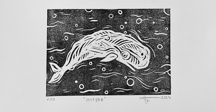 Biela veľryba na čiernom pozadí